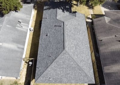 A roof that is being built in the middle of a street.