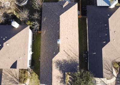 A bird 's eye view of some houses and trees.