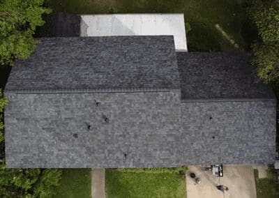 A bird 's eye view of a house with a driveway.