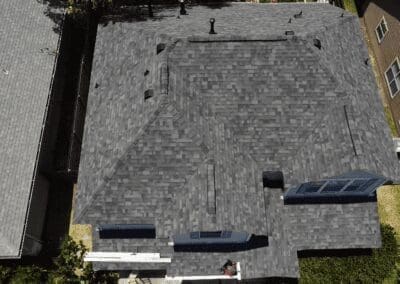 A black roof with some people standing on it