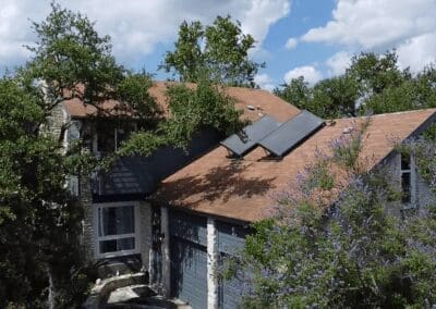 A house with some trees and a blue sky