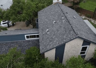 A house with a roof that has been damaged.